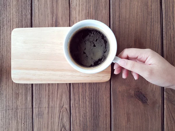 Hand Holding Black Coffee Wooden Table Horizontal Shot — Stock Photo, Image