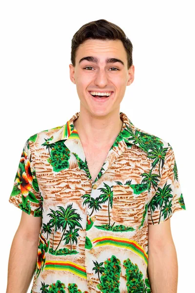 演播室拍摄年轻英俊的游客穿着夏威夷衬衫准备度假与白色背景隔离 — 图库照片
