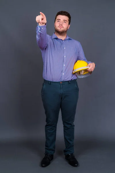 Studio Shot Young Handsome Overweight Bearded Businessman Engineer Hardhat Gray — Stock Photo, Image