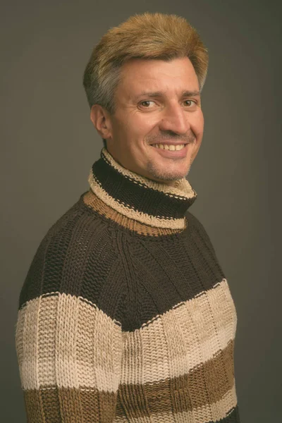 Studio Shot Man Blond Hair Wearing Turtleneck Sweater Gray Background — Stock Photo, Image