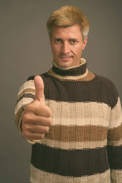 Studio Shot Man Blond Hair Wearing Turtleneck Sweater Gray Background — Stock Photo, Image