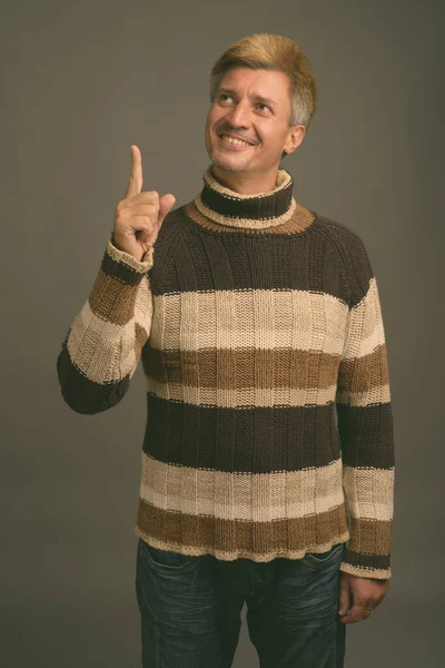 Studio Shot Man Blond Hair Wearing Turtleneck Sweater Gray Background — Stock Photo, Image