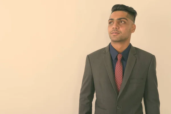 Studio Shot Young Indian Businessman Thinking While Wearing Suit White — Stock Photo, Image