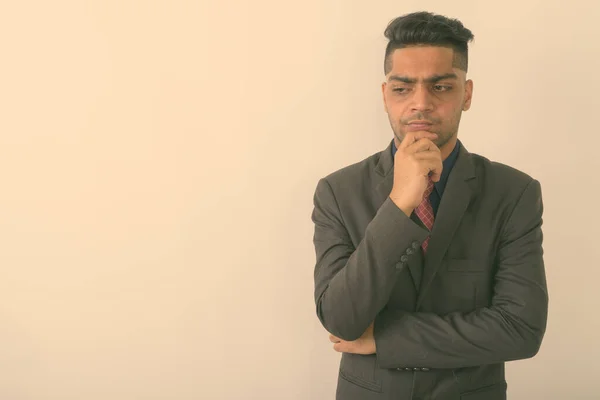 Studio Shot Young Indian Businessman Thinking While Wearing Suit White — Stock Photo, Image