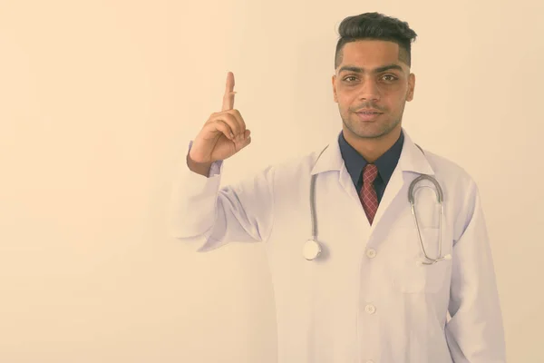 Studio Shot Young Indian Man Doctor Pointing Finger White Background — Stock Photo, Image