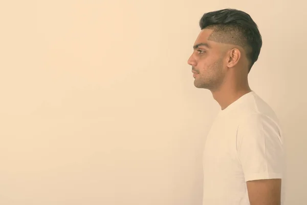 stock image Profile view of young Indian man against white background