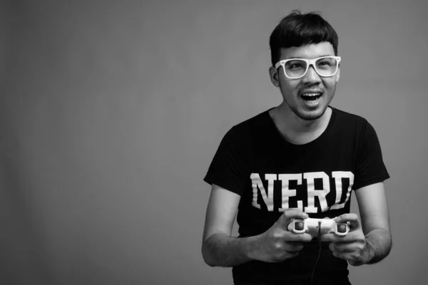 Studio Shot Young Asian Nerd Man Wearing Eyeglasses While Playing — Stock Photo, Image