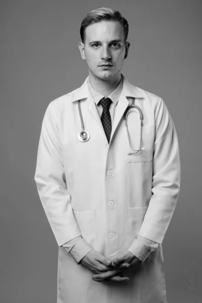 Studio Shot Young Handsome Man Doctor Blond Hair Gray Background — Stock Photo, Image