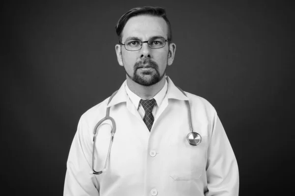 Studio Shot Blond Bearded Man Doctor Goatee Gray Background Black — Stock Photo, Image