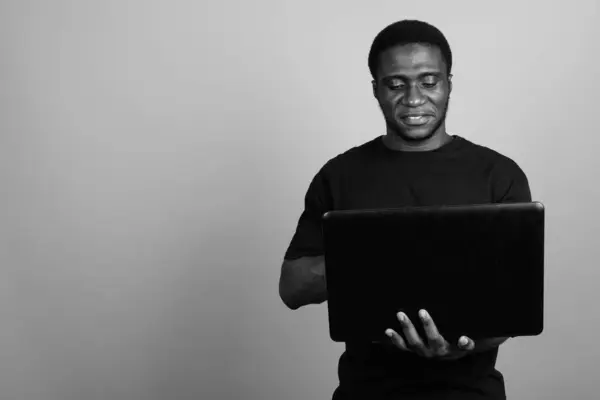 Studio Shot Young African Man Wearing Black Shirt Gray Background — Stock Photo, Image