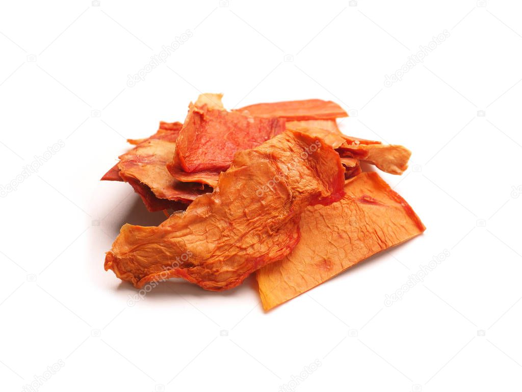 Dried organic papaya slices on a white studio background, healthy food concept