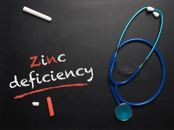 The words zinc deficiency on a chalkboard — Stock Photo, Image