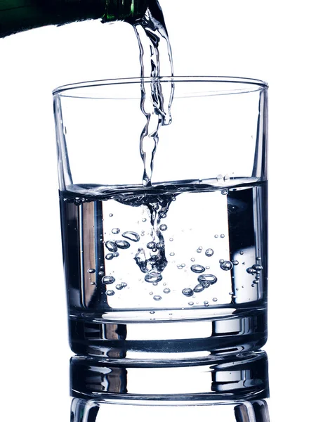 Pouring fresh water in a glass — Stock Photo, Image