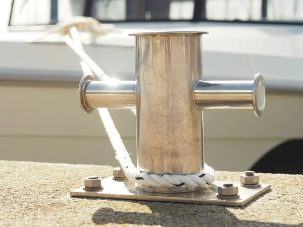 Stainless steel bollard with a rope — Stock Photo, Image