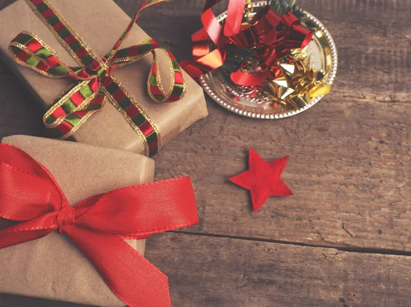 Christmas gifts on a wooden floor — Stock Photo, Image