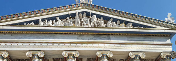 Panoramic view of god sculptures and golden detail ornaments in iconic Academy of Athens, Greece