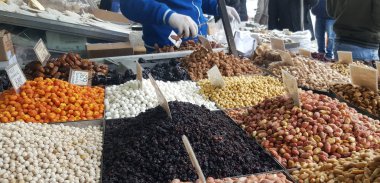 ATHENS, GREECE - JANUARY 14, 2019: Stand with different kinds of nuts on the street market in Athens, Greece