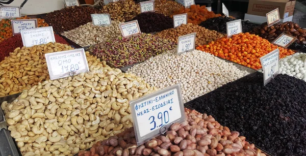 ATHENS, GREECE - JANUARY 14, 2019: Stand with different kinds of nuts on the street market in Athens, Greece