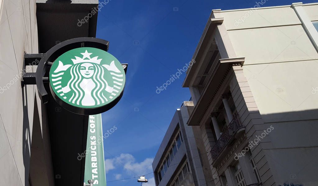 ATHENS, GREECE - JANUARY 18, 2019:  Sign Starbucks Coffee. Starbucks is the largest coffeehouse company in the world
