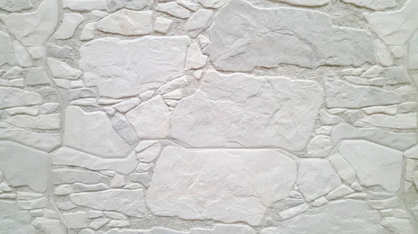 Fragmento de una pared hecha de piedras blancas — Foto de Stock