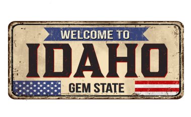 Beyaz arkaplandaki Idaho klasik paslı metal tabelasına hoş geldiniz.