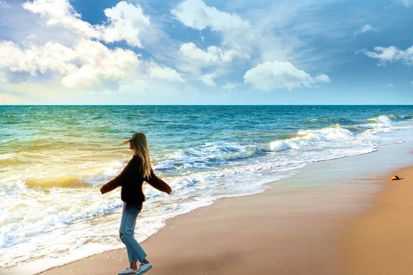 Woman enjoying the peace of ocean