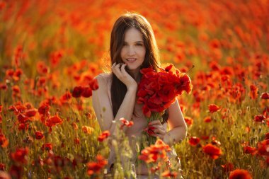 young girl in a field with red poppies clipart
