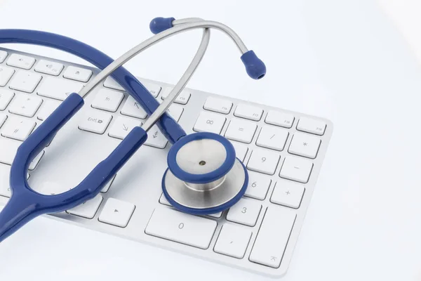 Stethoscope and keyboard of a computer — Stock Photo, Image