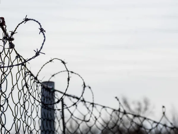 Fence with barbed wire for security — Stock Photo, Image