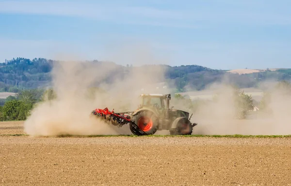 A tractor on dry field — Stock Photo, Image