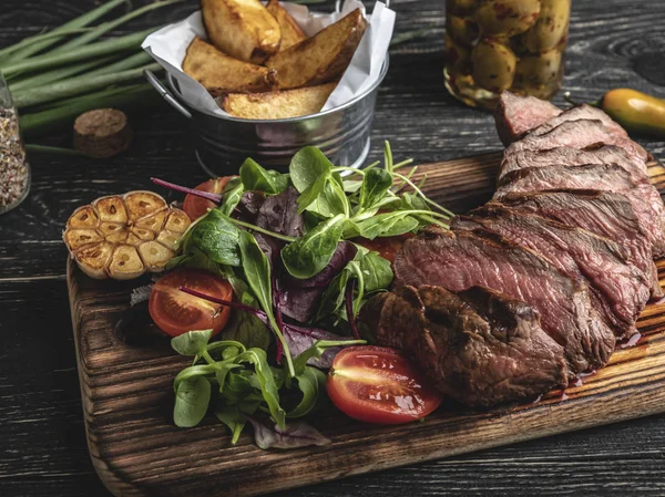 Sliced Juicy Steak Medium Rare Board Herbs Fried Potatoes Spices — Stock Photo, Image