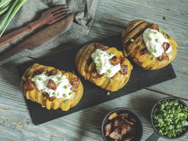 Baked Potato Stuffed Cheese Bacon Sour Cream Loaded Hasselback Potatoes — Stock Photo, Image