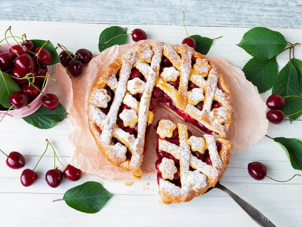 Tasty homemade cherry pie sweet on rustic wooden white background delicious