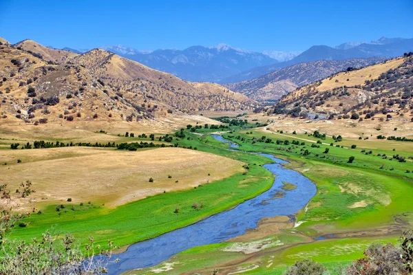 Mountain river valley landscape. River valley in mountains.