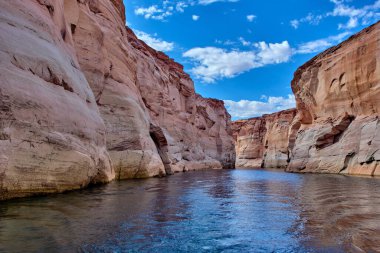 View of narrow, cliff-lined canyon from a boat in Glen Canyon National Recreation Area, Lake Powell, Arizona clipart