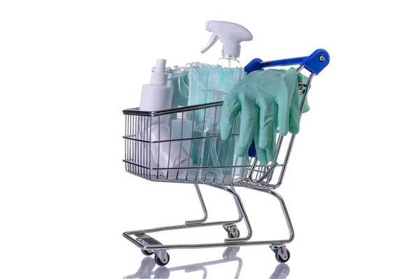 Shopping cart filled with different kinds of desinfectants on white background — Stock Photo, Image