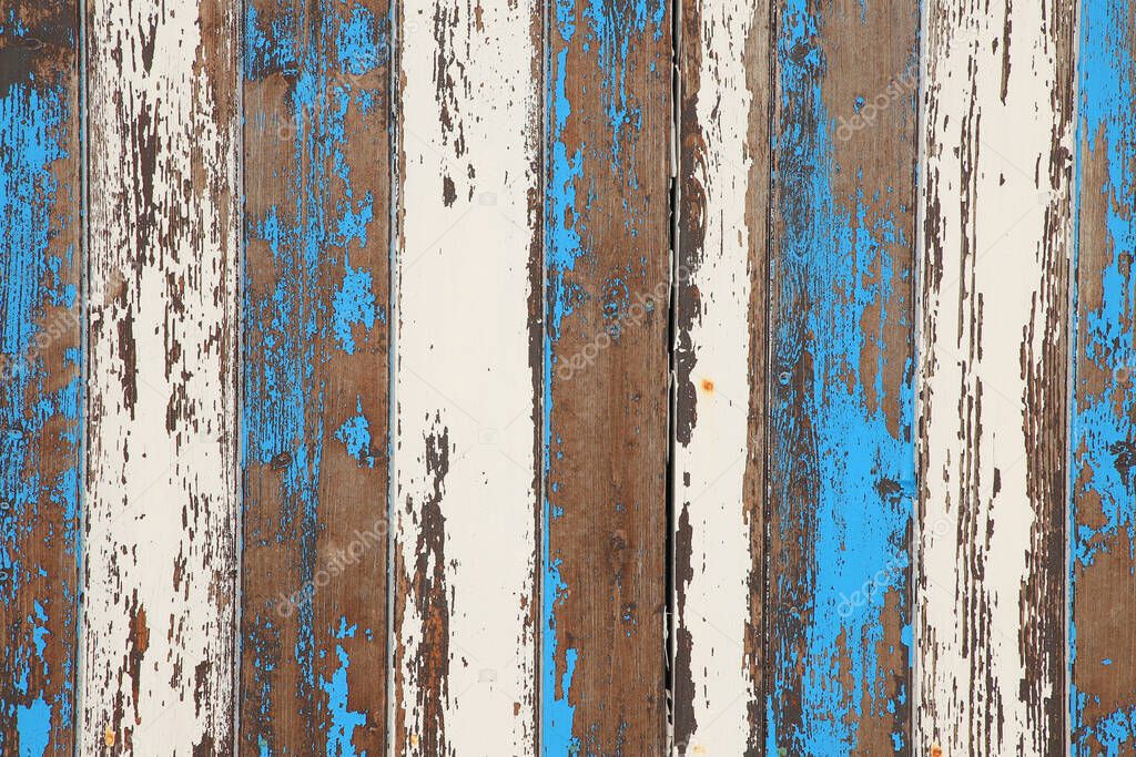 old wooden panel backdrop of paint peeling off surfaces