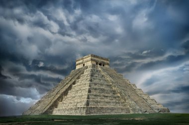 Pyramid in Chichen Itza, Temple of Kukulkan against dramatic sky. Yucatan, Mexico clipart