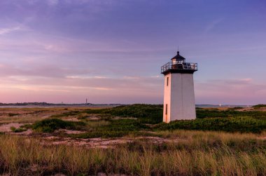 Wood End lighthouse during sunset in Provincetown, Massachusetts, USA. clipart