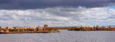 Traditional village on floating Uros islands on lake Titicaca in Peru, South America clipart