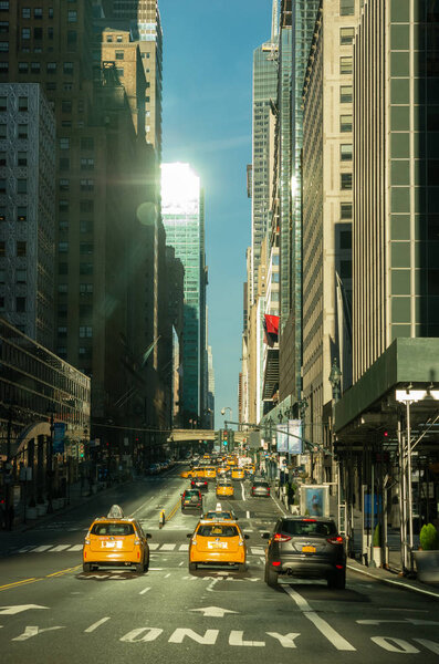 New York, USA - November 4, 2018: Yellow NYC taxi cabs on street in New York City