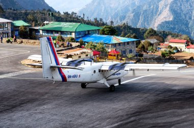 Lukla, Nepal - March 4, 2014: Tenzing-Hillary Airport the most dangerous airport in the world in Lukla, Nepal. clipart