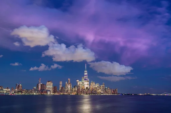 Manhattan skyline at night with dramatic sky, New York City — Stok Foto