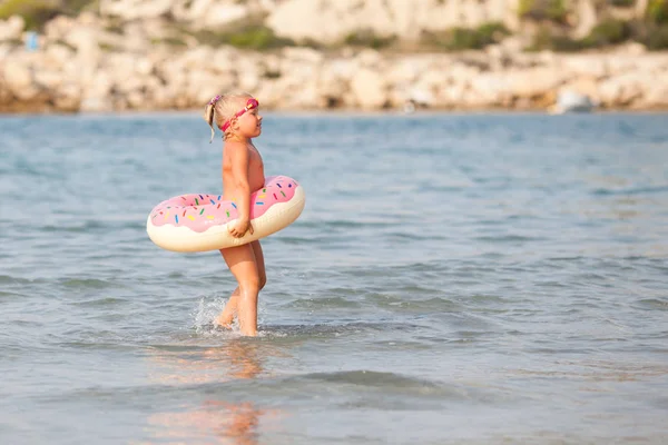 Little cute happy girl bathes in sea, Spain — Stock Photo, Image