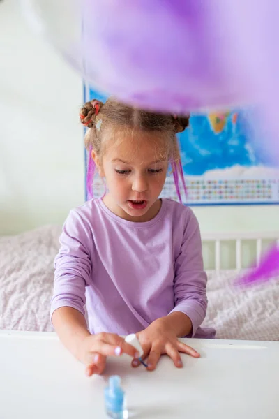 Little Pretty Girl Paints Herself Nails Varnish — Stock Photo, Image