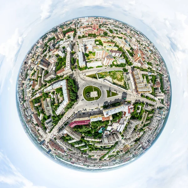 Aerial city view with crossroads and roads, houses, buildings, parks and parking lots. Sunny summer panoramic image — Stock Photo, Image