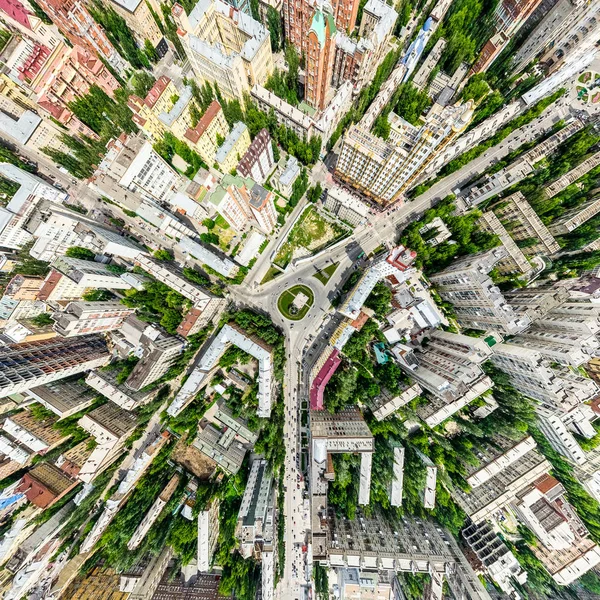 Aerial city view with crossroads and roads, houses, buildings, parks and parking lots. Sunny summer panoramic image — Stock Photo, Image