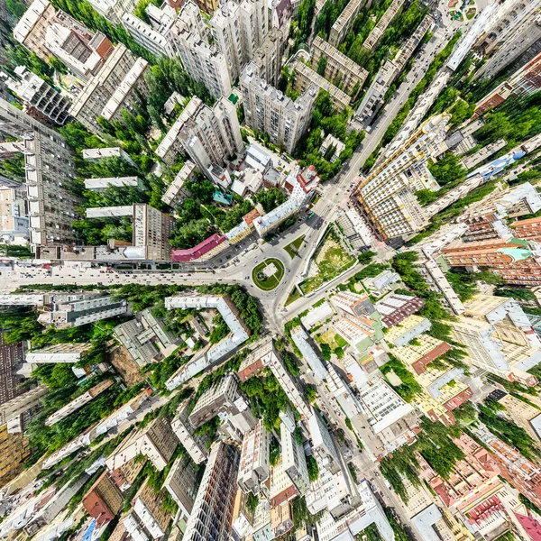 Aerial city view with crossroads and roads, houses, buildings, parks and parking lots. Sunny summer panoramic image — Stock Photo, Image