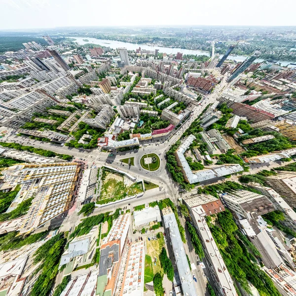 stock image Aerial city view with crossroads and roads, houses, buildings, parks and parking lots. Sunny summer panoramic image