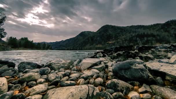 Time lapse shot of a river near mountain forest. Huge rocks and fast clouds movenings. Horizontal slider movement — Stock Video